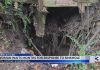 City to blame for massive sinkhole in yard, says woman (Video)